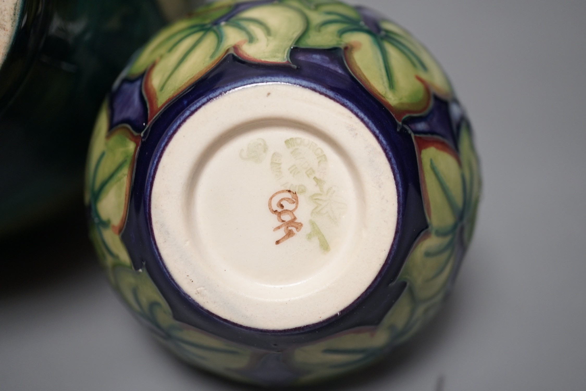 A Moorcroft orchid pattern vase and another smaller vase, orchid vase 19cms high